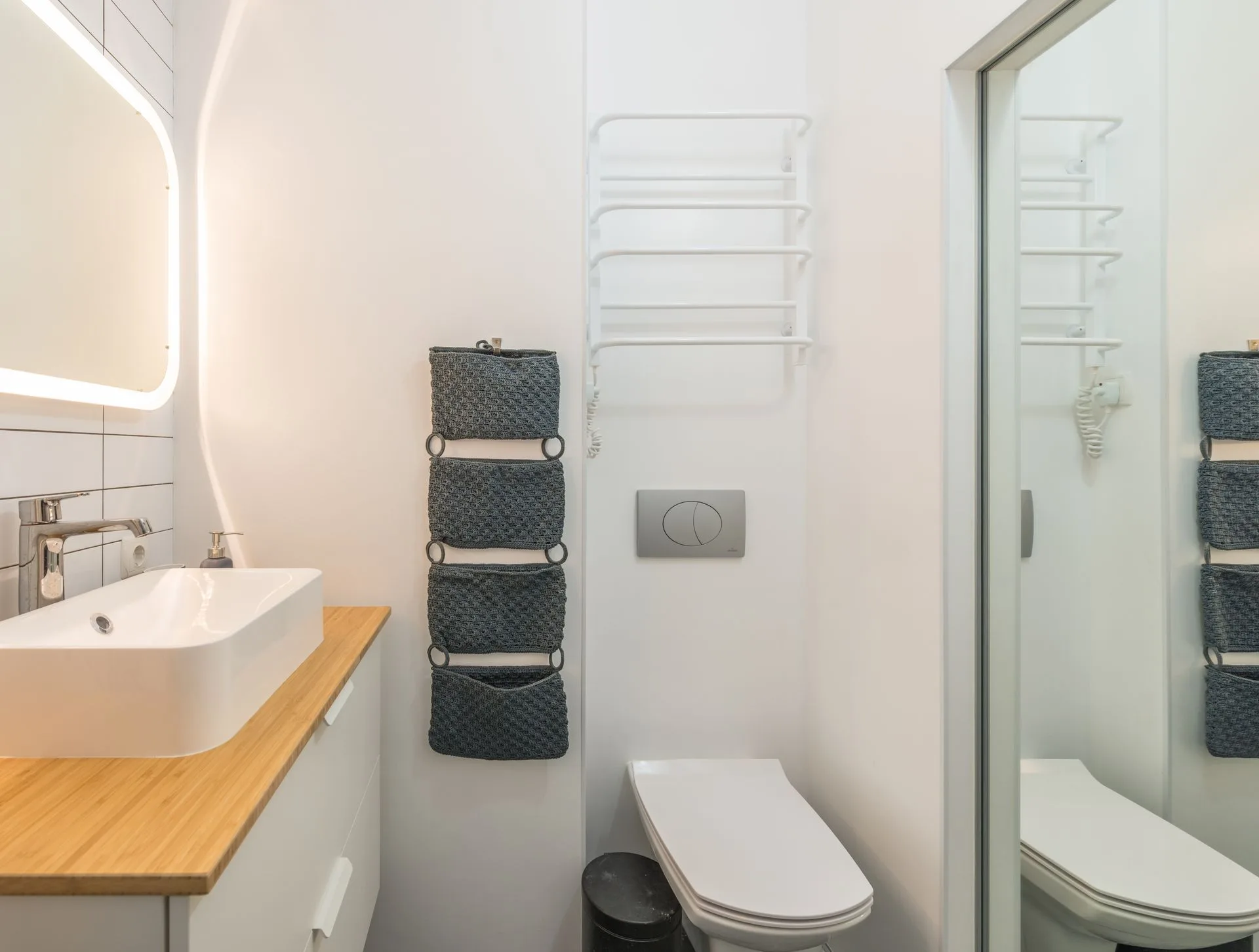 Bright modern bathroom with sink and mirror in Plano, TX